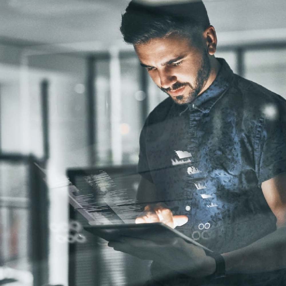 ADN-TI technician working on a tablet