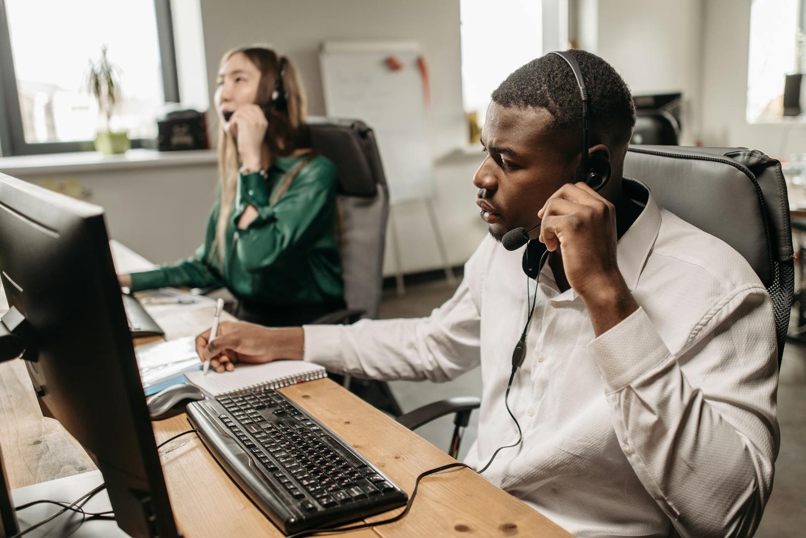 Technical support agents at work with headsets